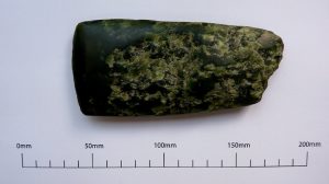 Green stone shaped in to axe shape, measurement in centimetres below